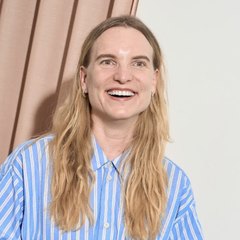 Nicole, smiling